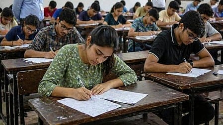 In the image many children are shown giving exams in a classroom