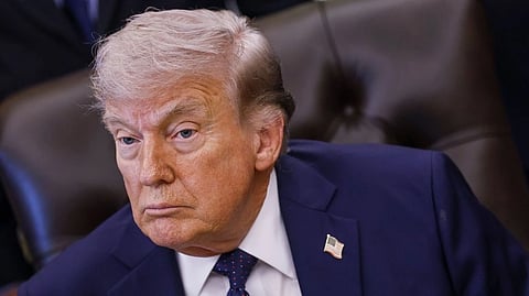 Donald Trump speaking during a public appearance amid rising tensions between the United States and Iran over peace negotiations and the Strait of Hormuz crisis.