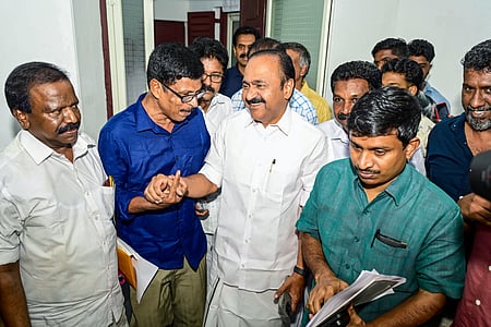 In the image VD Satheesan is shown smiling with other party members