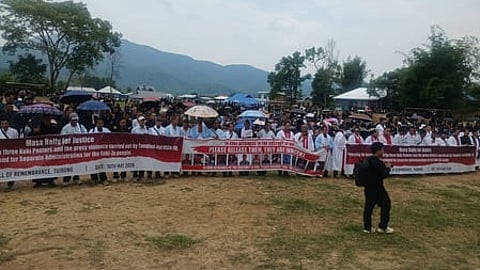 a large group standing with banners