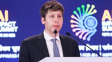 In the image Sam Altman is shown addressing the people in AI Summit