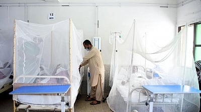 photograph showcasing the inside of a hospital room with patients affected by Measles lying inside