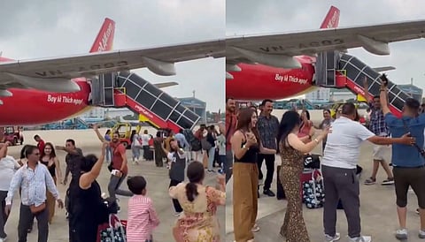 In this image, a group of Indian tourists are playing garba at Vietnam airport, the video clip of them playing garba has created an overnight debate on internet.