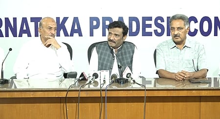 In the image three leaders from KPCC are shown including D.K. Shivakumar