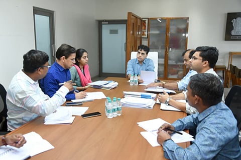 photo showcasing a group of people convening together at a table