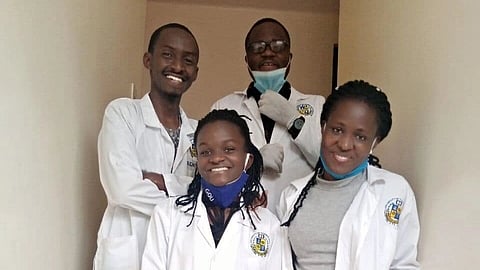 In this image, there are four young medical students.
