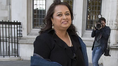 In the image Varsha Gohli is shown outside the UK court smiling