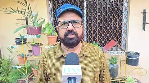 In the image a man is shown speaking to news organisation IANS