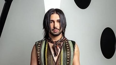 In the image Orry is shown modeling with long hair