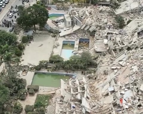 Image of Venezuela earthquake. the image contains building and debris destruction.