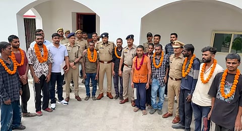 Rescued bonded laborers in Muzaffarnagar after police raid on factory where they were allegedly beaten, confined and guarded by pit bulls