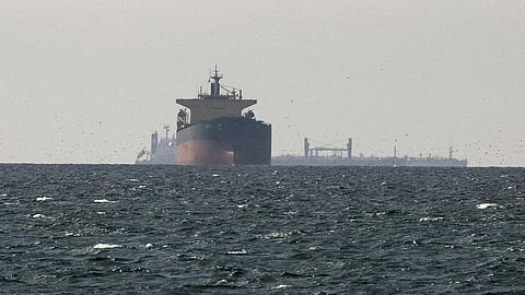 Cargo vessels passing through the Strait of Hormuz during heightened tensions between Iran and the United States