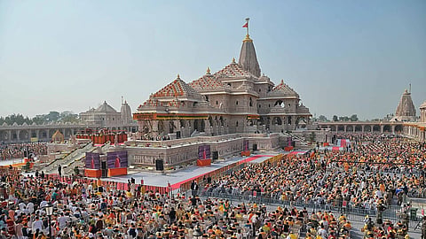 Ram Mandir structure surrounded by crowd on Pran Prathista ceremony.