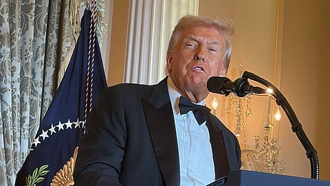 In the image president Donald Trump is shown adressing the people