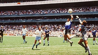 Diego Maradona scoring the iconic Hand of God