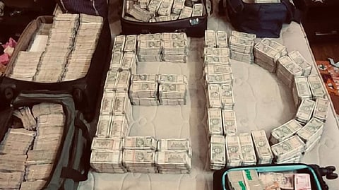 Stacks of cash arranged in the letters ED.