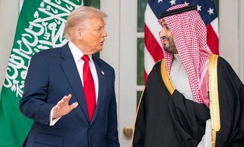 Image of trump and Prime Minister Mohammed bin Salman talking to each other.