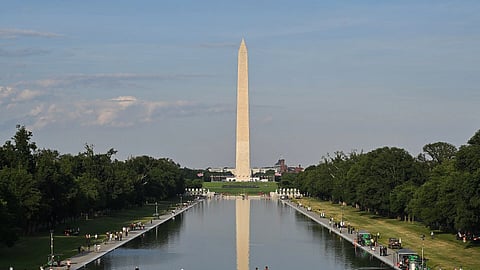 The Washington Monument reflecting in the Lincoln Memorial Reflecting Pool after the pool was restored and painted blue.