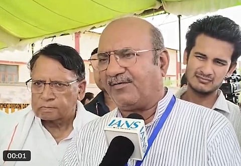 In the image Datia Congress' Ghanshyam Singh is shown speaking to news agency IANS