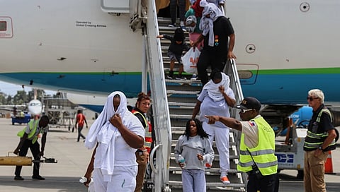 haitian getting out of the plane