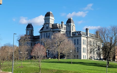 The image is of a building at Syracuse University.