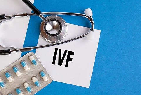 The image shows stethoscope, pills and ivf written on paper.