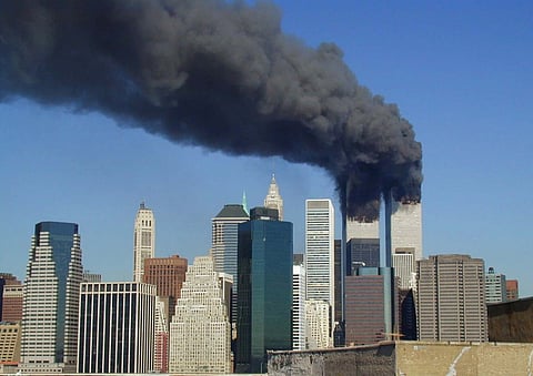 Plumes of smoke billow from the World Trade Center after the September 11th attacks (2001)