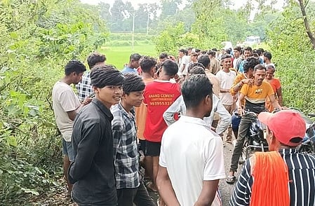 A group of people standing in a foresty region in Jharkhand