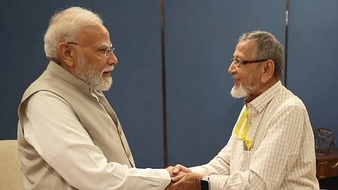 In the image PM Modi is shown with friend Asgar Ali Vohra