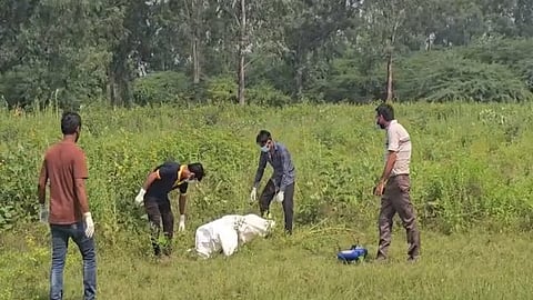 People recovering the body of a rape victim