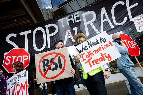 Stop the AI race banner held by protestors in San Francisco