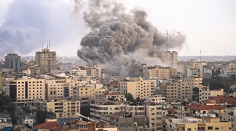 Image of huge plume of smoke coming from a building during Israeli airstrike on Gaza Strip during Gaza War 23-25.