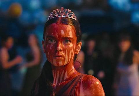 Image from amazon's carrie series where a girl is standing with blood all over her body