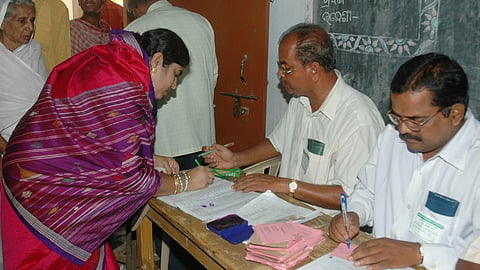 Voter registering her name with the EROs