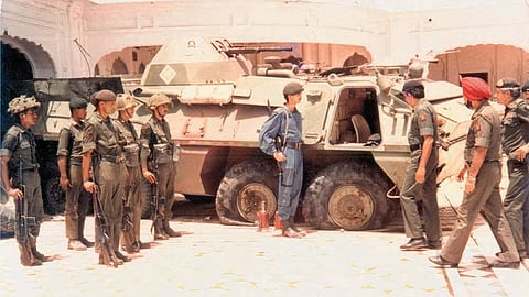 An army tank and other officials