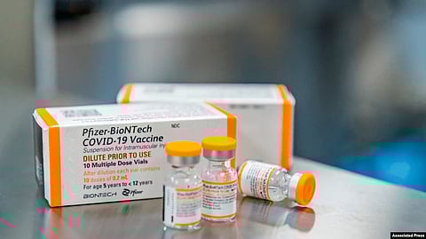 A youth receives the Pfizer-BioNTech Covid-19 coronavirus vaccine at Cu Chi Town Primary School in Ho Chi Minh City on Oct. 27, 2021, as Vietnam began vaccinating adolescents between the ages of 12 to 17.  Image credit: VOA