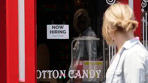 Now Hiring signs at a temporary post office location inside the former K-mart on Lake Street, Minneapolis Image source: wikimedia commons