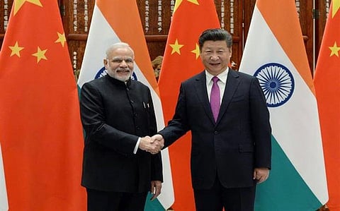 China says ties with India developing with ‘sound momentum’