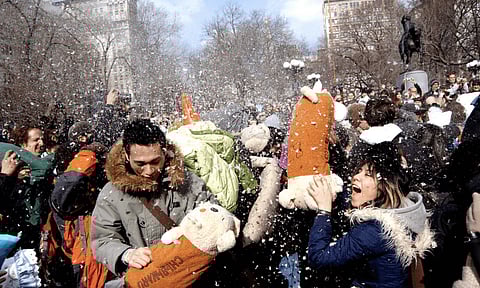 International Pillow Fight Day celebrated around Globe, Dozens of people participate in pillow fight in downtown New York