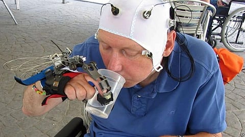 Scientists develop a mind-controlled Robotic hand that allows people with Quadriplegia to perform Everyday Tasks