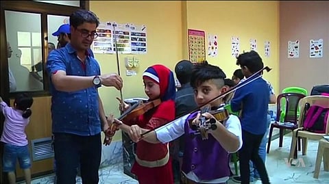 Iraqi Kids growing up in the sound of explosions and sirens, find Refuge in Music