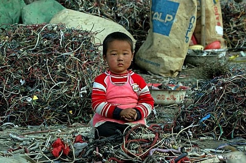 For just £2 a day, Children put their blood and sweat in India’s Biggest e-waste graveyard at Seelampur
