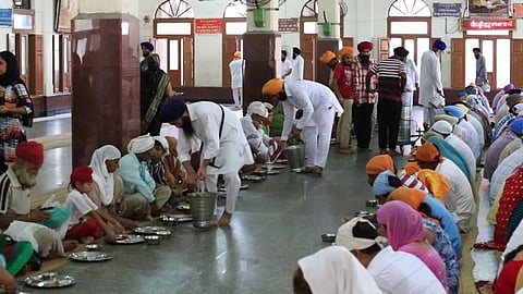 Sikhs in Northampton town serve free hot meals to the poor on Sundays