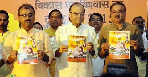 BJP poll manifesto promises free laptops, two-wheelers, TVs