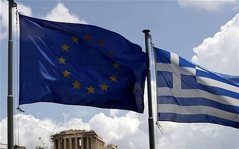 Greece reveals new debt deal, pensioners line up at banks