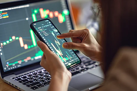 Closeup - Woman is checking Bitcoin price chart on digital exchange on smartphone, cryptocurrency future price action prediction. (Pixabay)
