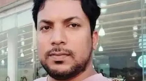 बांग्लादेश में हिंसा के संदर्भ में एक व्यक्ति की तस्वीर।