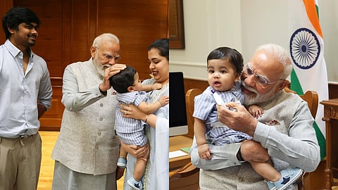 ഓമിക്കൊപ്പം പ്രധാനമന്ത്രി നരേന്ദ്ര മോദി