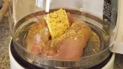 Man cooks chicken in coffee machine