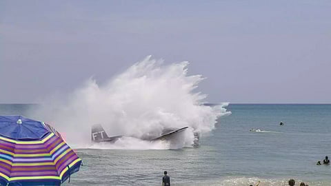 WWII era plane makes emergency landing in beach